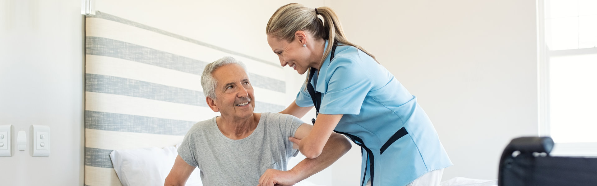 caretaker assessing elderly man