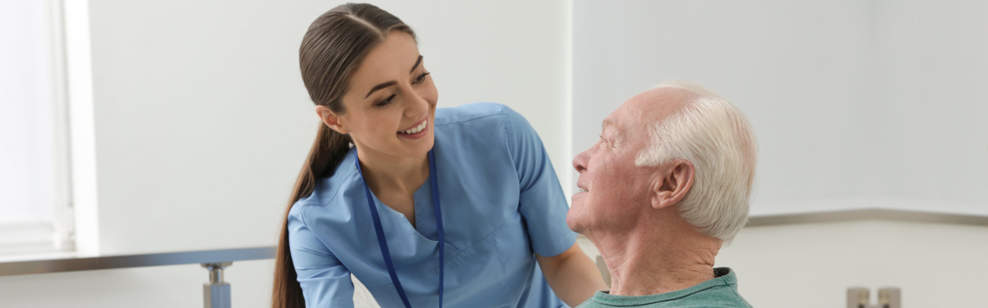 caretaker smiling to elderly