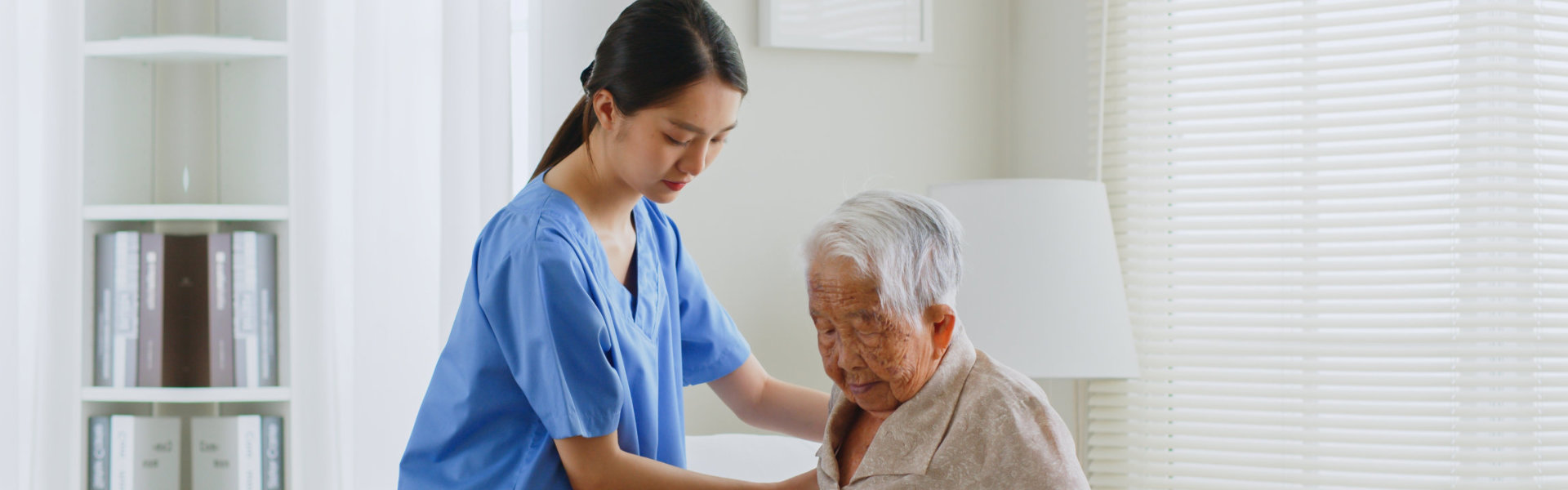 caretaker helping elderly